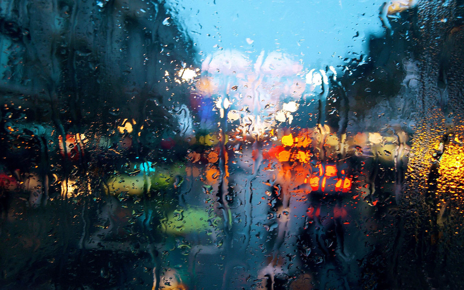 colourful rainy drops on window wallpaper